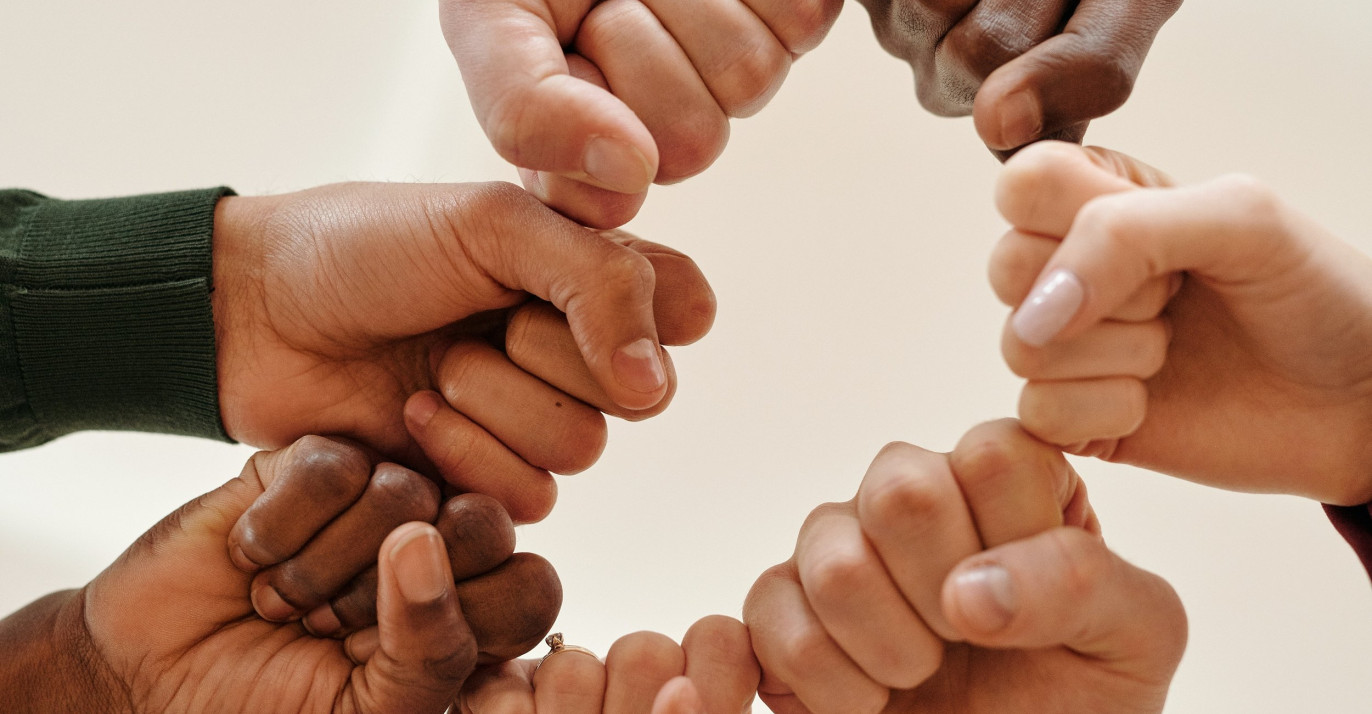 Fists of people with different skin tone
